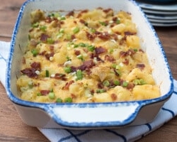 A baking dish filled with twice baked potato casserole.