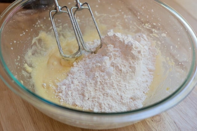 The dry ingredients are added to the mixing bowl.