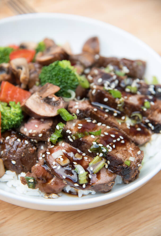 Grilled Steak Teriyaki on white rice with stir fried veggies.