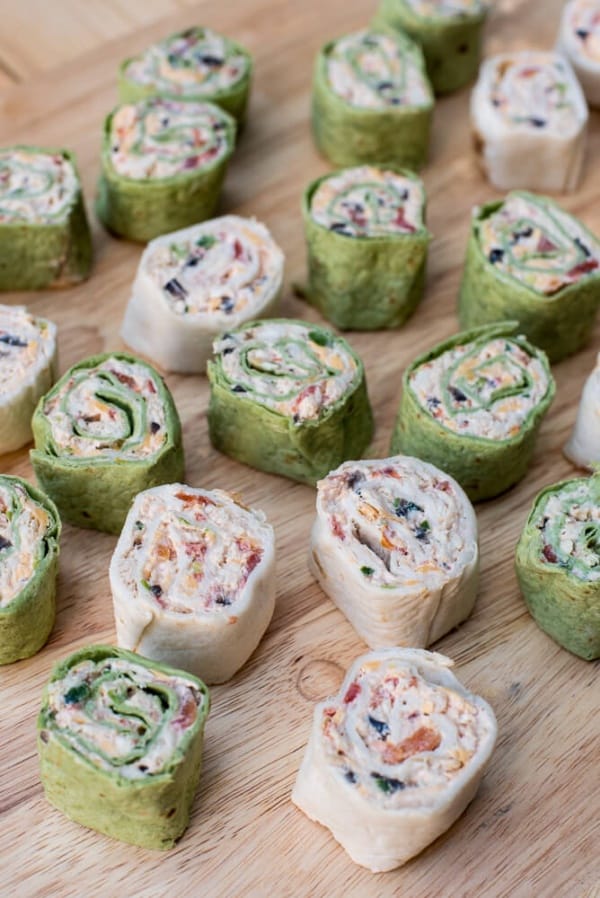 The classic party appetizer with a Southwest twist. These pretty Southwest Chicken Tortilla Pinwheels are made ahead and are waiting for you in the refrigerator to slice and serve at party time. A great addition to your appetizer menu at any time of year.
