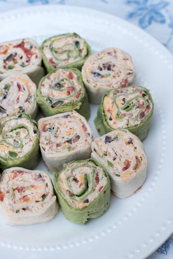 The classic party appetizer with a Southwest twist. These pretty Southwest Chicken Tortilla Pinwheels are made ahead and are waiting for you in the refrigerator to slice and serve at party time. A great addition to your appetizer menu at any time of year.