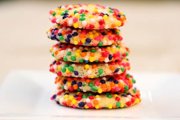 A stack of cookies with sprinkles.
