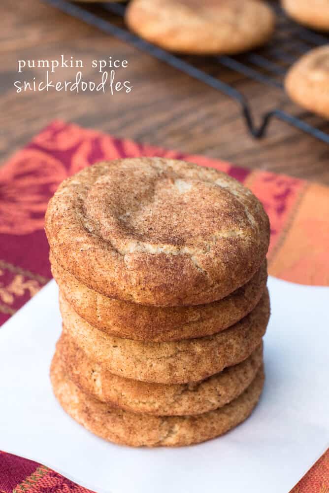 Pumpkin Spice Snickerdoodles stacked on a white plate with text overlay.