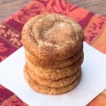 A stack of pumpkin spice snickerdoodles on a white plate.