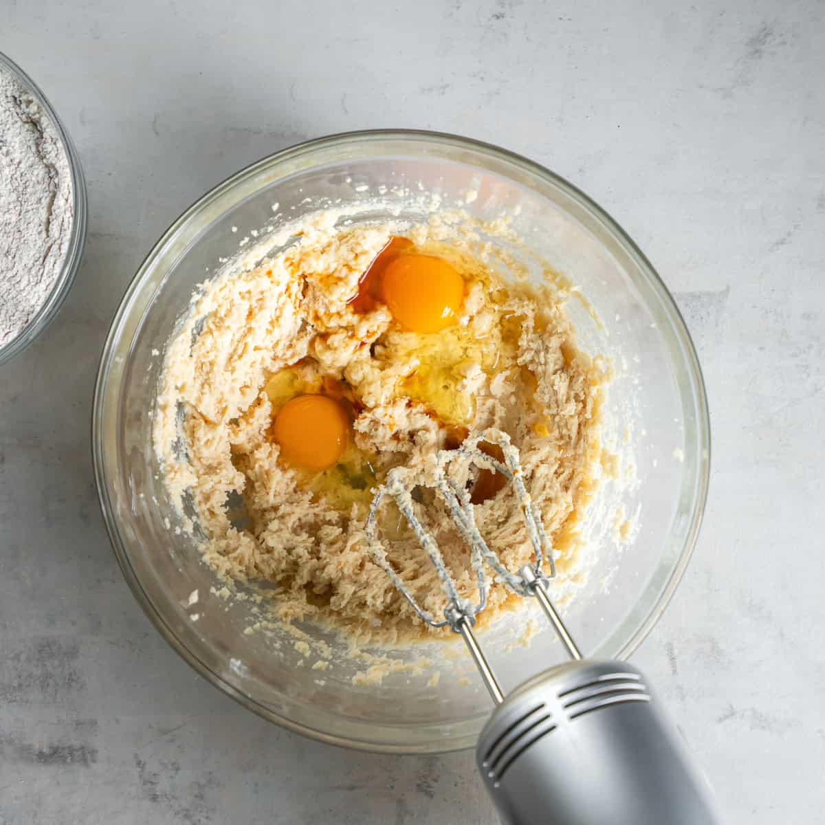 Eggs and vanilla added to the creamed butter and sugars.