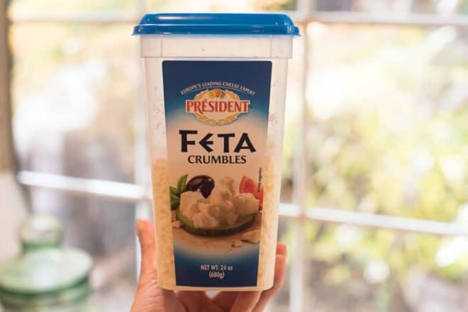  A large container of President Feta Crumbles purchased at Costco.