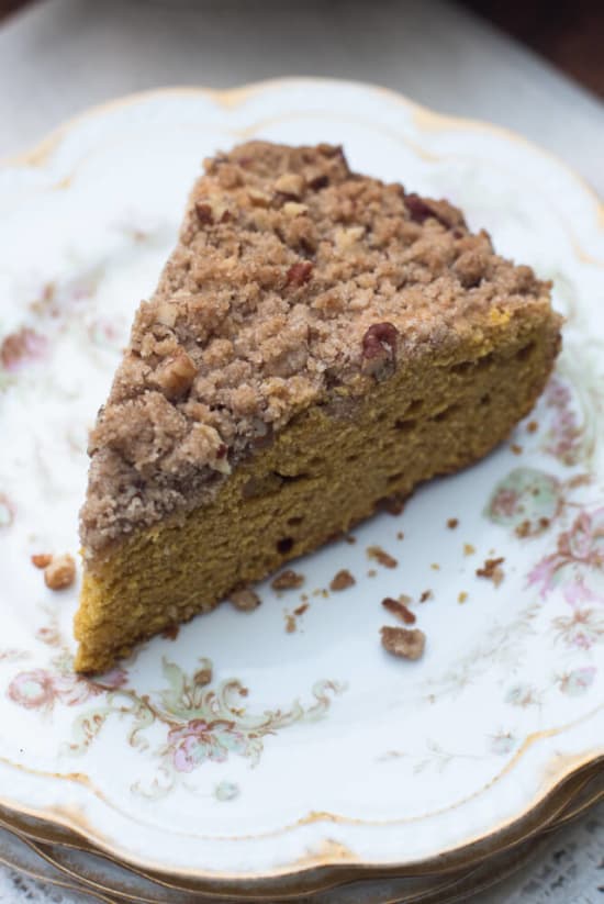 A slice of Pumpkin Pecan Crumb Cake on a china plate.
