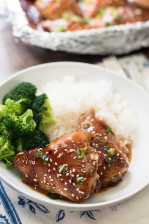 A bowl with rice, teriyaki chicken, and broccoli.