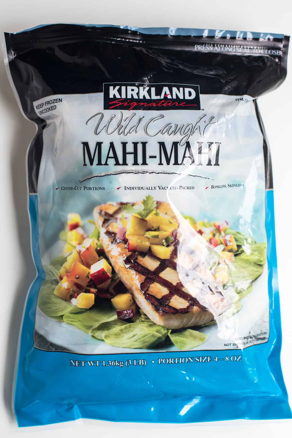 A bag of Kirkland frozen mahi mahi fillets.