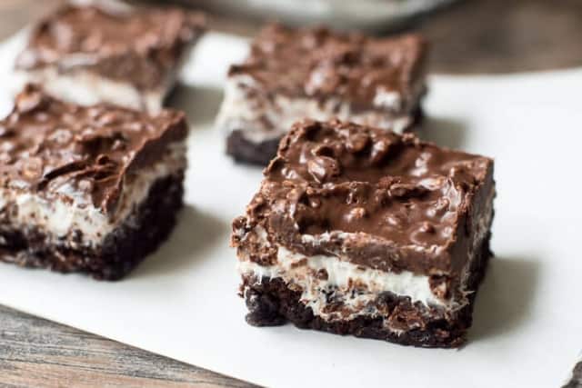 Brownie Marshmallow Crunch Bars on parchment paper.