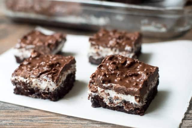 Brownie Marshmallow Crunch Bars on parchment paper.