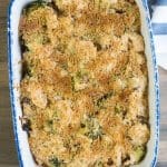A baking dish filled with chicken broccoli and rice casserole topped with bread crumbs.