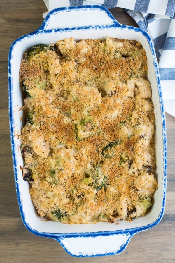 An over the top shot of Creamy Chicken Broccoli and Rice Casserole in a blue and white casserole dish.