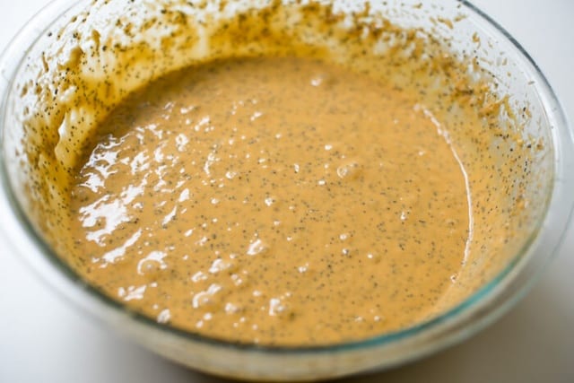 The cake batter in a glass mixing bowl.