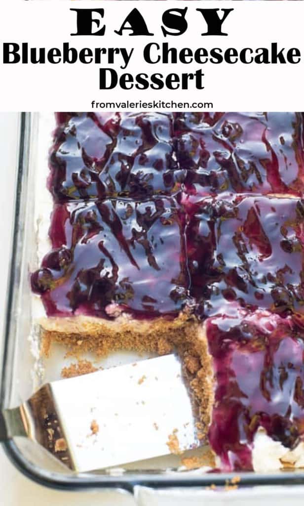 A spatula in a baking dish filled with Easy Blueberry Cheesecake Dessert.