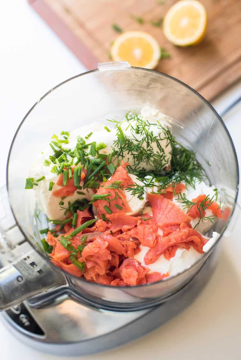 The ingredients in the bowl of a food processor.