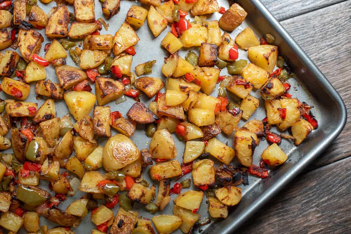 Roasted breakfast potatoes on a baking sheet.