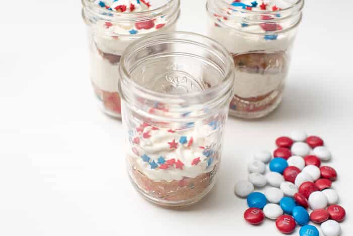 The frosting is topped with star sprinkles and red, white, and blue M&M's.
