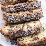 Slices of chocolate chip crumb cake on parchment paper.