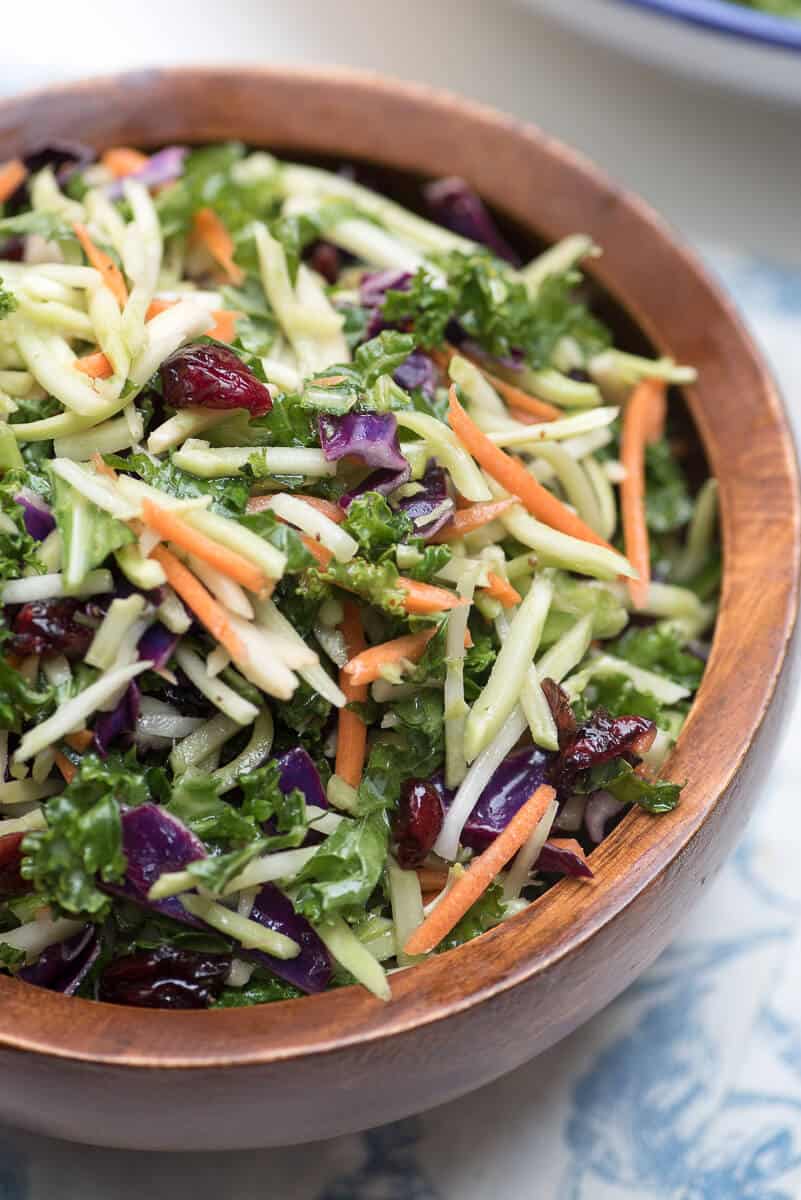 5 Minute Broccoli Kale Slaw in a wooden serving bowl.