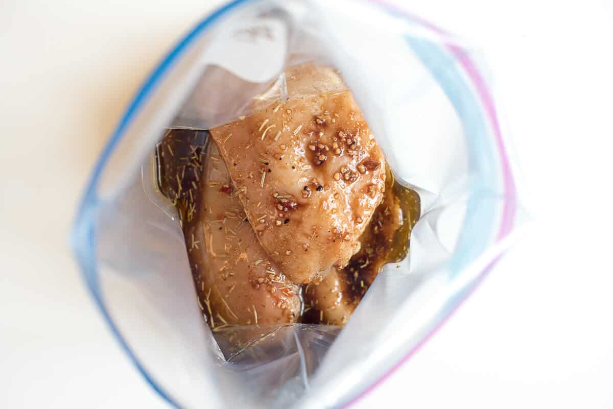 Chicken in a plastic storage bag with the marinade.
