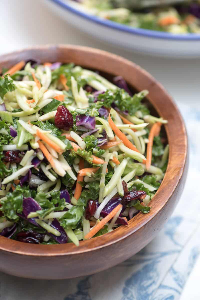 5 Minute Broccoli Kale Slaw in a small wooden bowl.