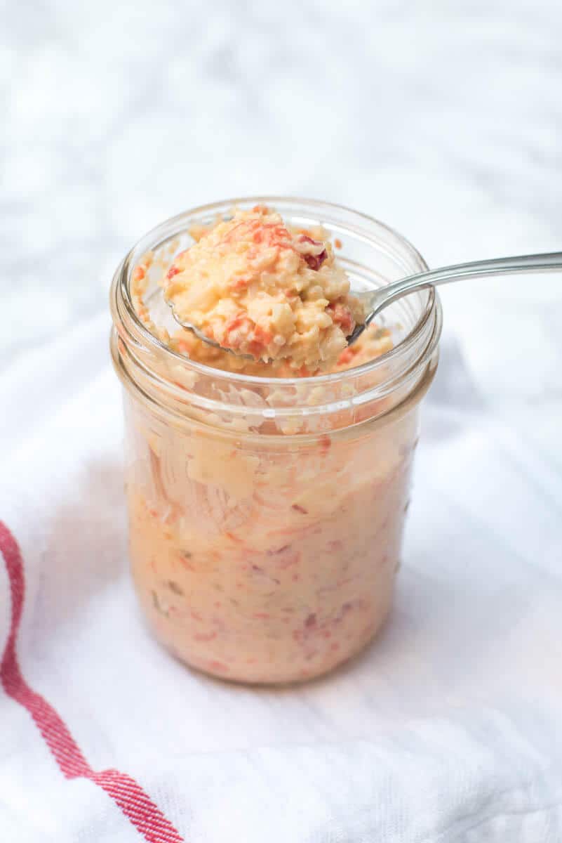 Giardiniera Sandwich Spread in a mason jar with a spoon.