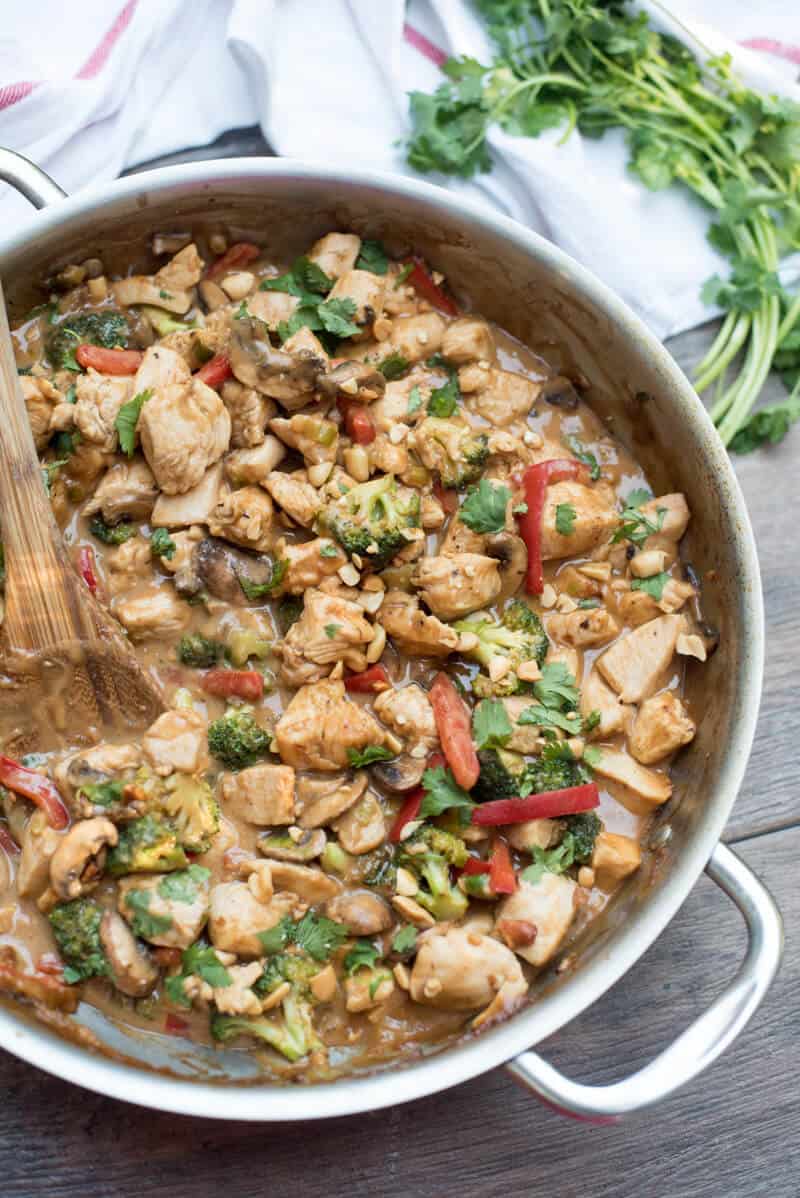 Easy Peanut Chicken Stir Fry in a stainless steel skillet shot from over the top.
