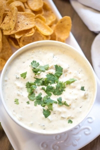 Easy Queso Verde in a white bowl topped with cilantro.