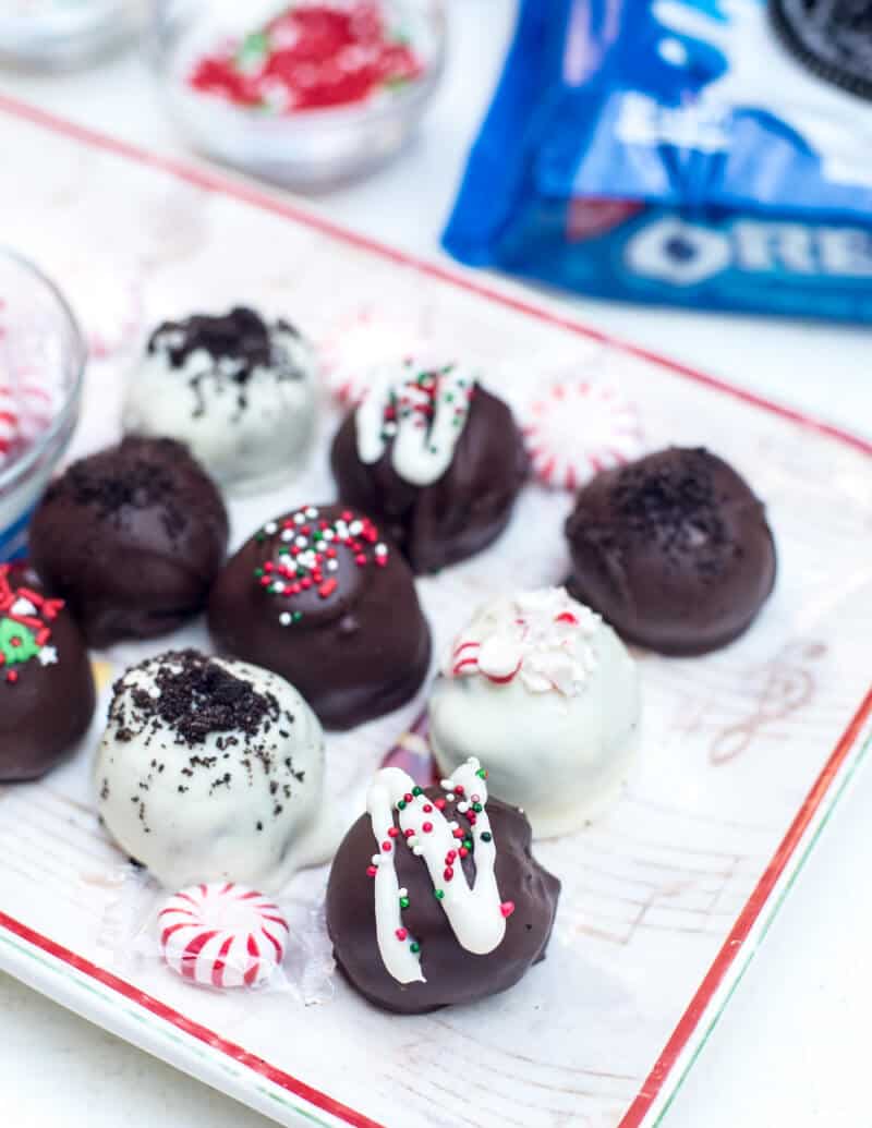 Holiday Oreo Cookie Balls on a Christmas tray.