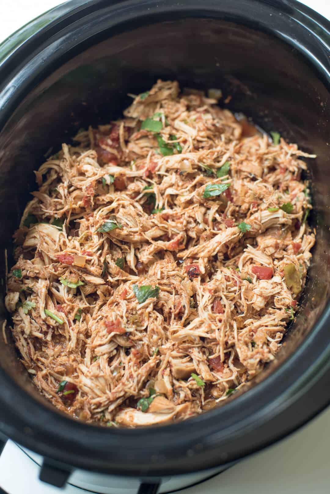 Crock Pot shredded chicken for tacos from over the top in a slow cooker.