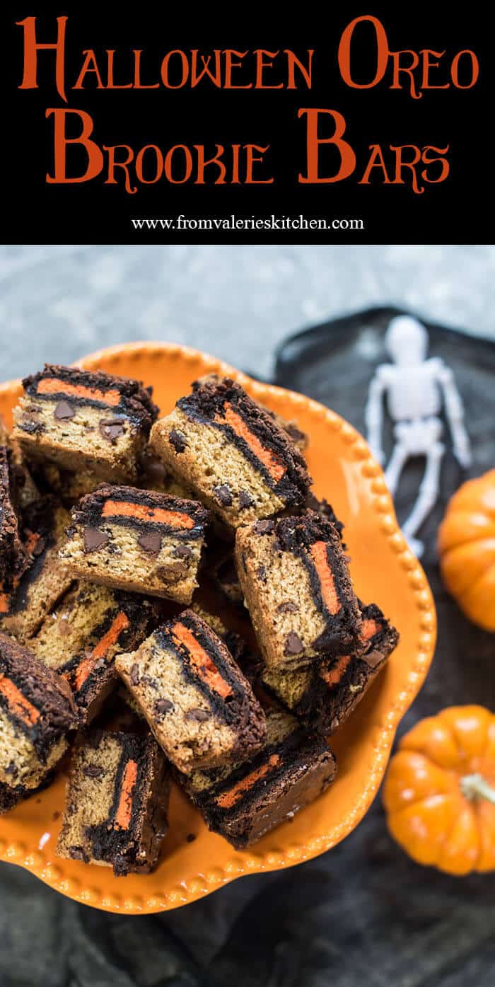 Halloween Oreo Brookie Bars on an orange platter with a plastic skeleton and mini pumpkins in the background.