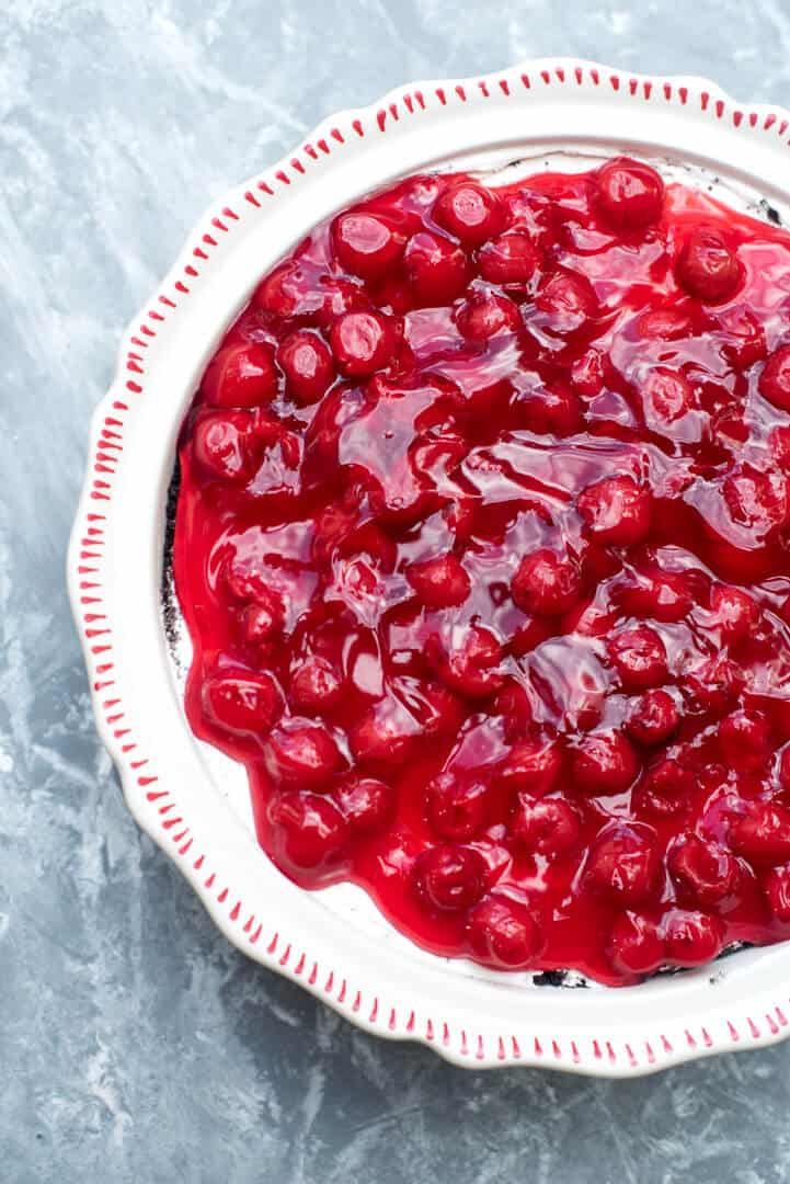 An over the top image of the cheesecake in a white dish.