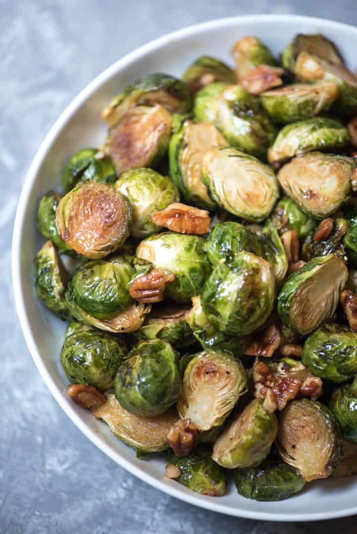 Maple Pecan Roasted Brussels Sprouts in a white bowl.
