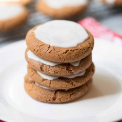 Molasses Cookies stacked on a plate.