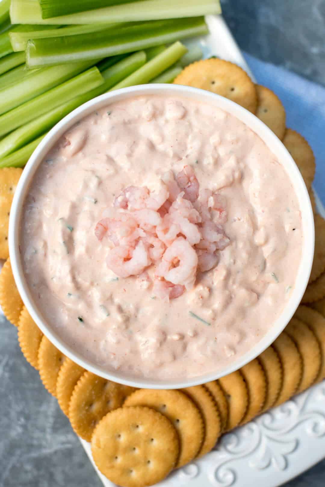 An over the top shot of Shrimp Dip in a white bowl.