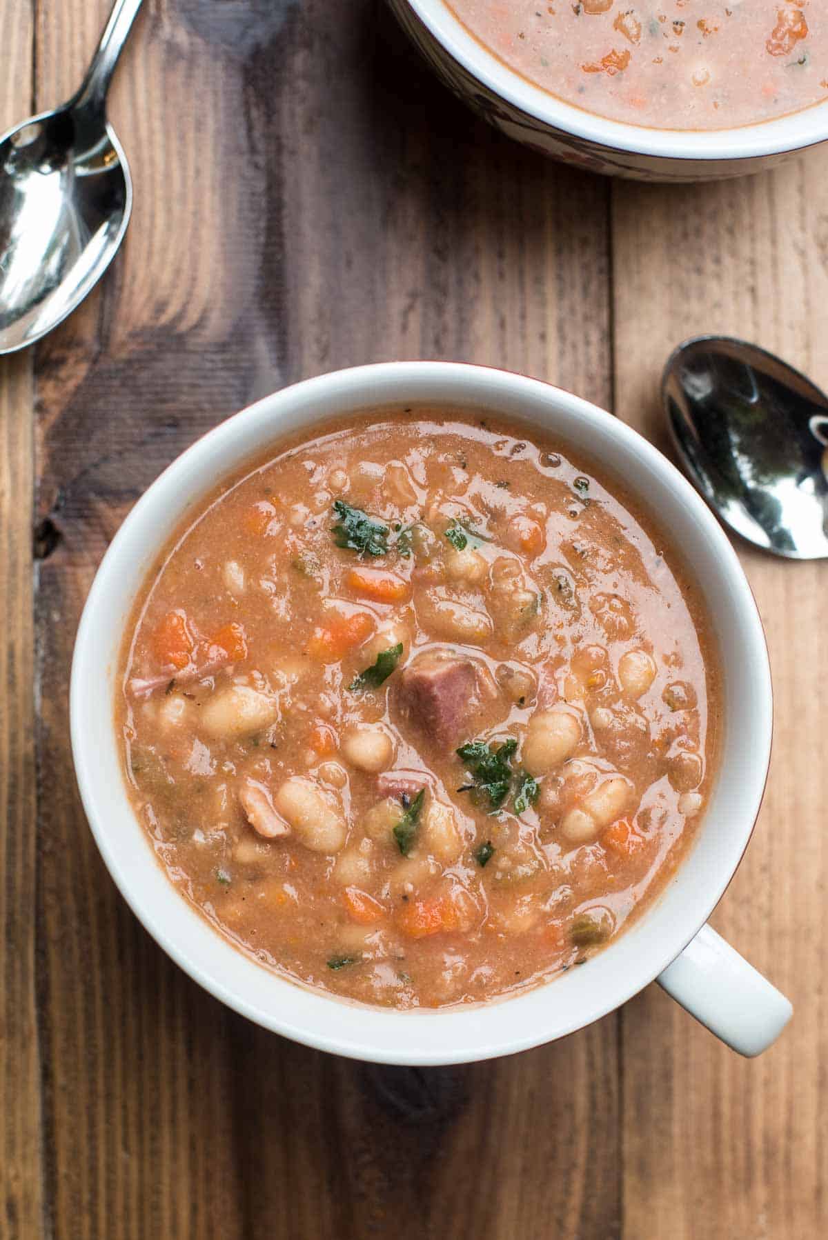 Ham and bean soup in a soup mug.