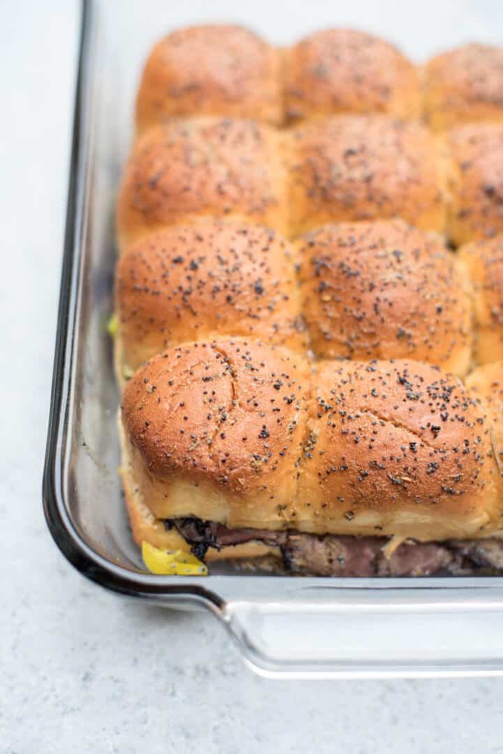 The sliders in a baking dish.