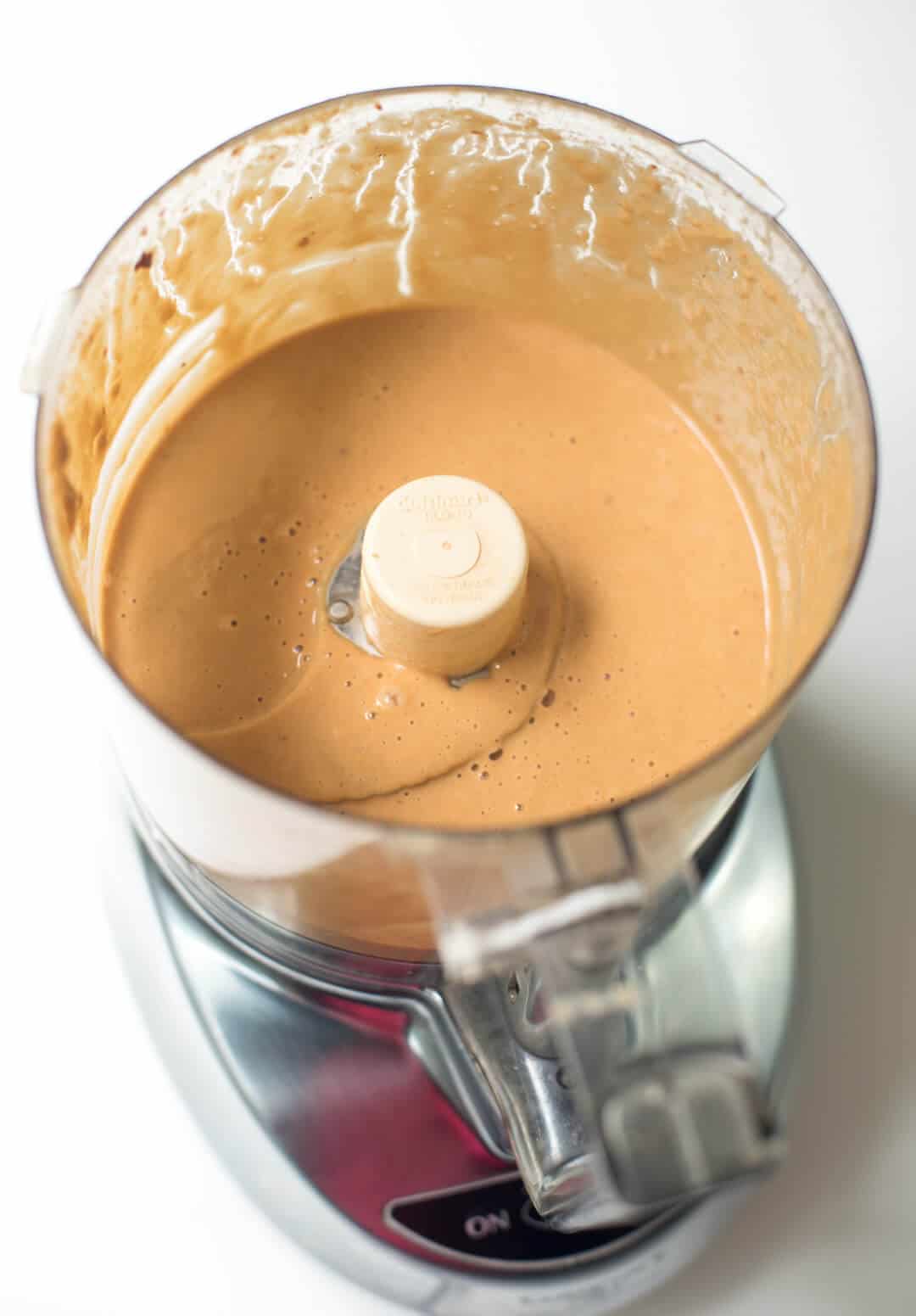 Peanut sauce after being blended in a food processor.