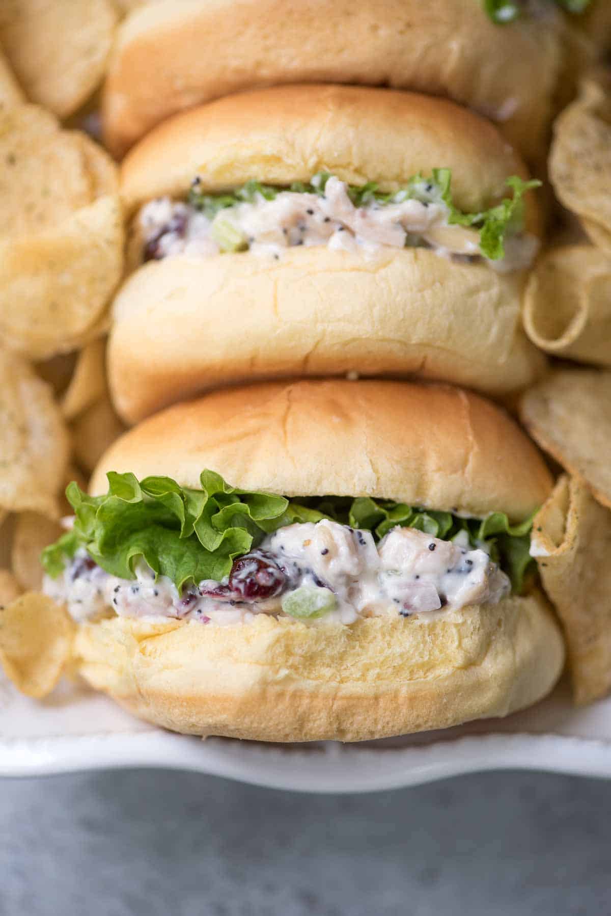 Small buns filled with cranberry chicken salad and lettuce.
