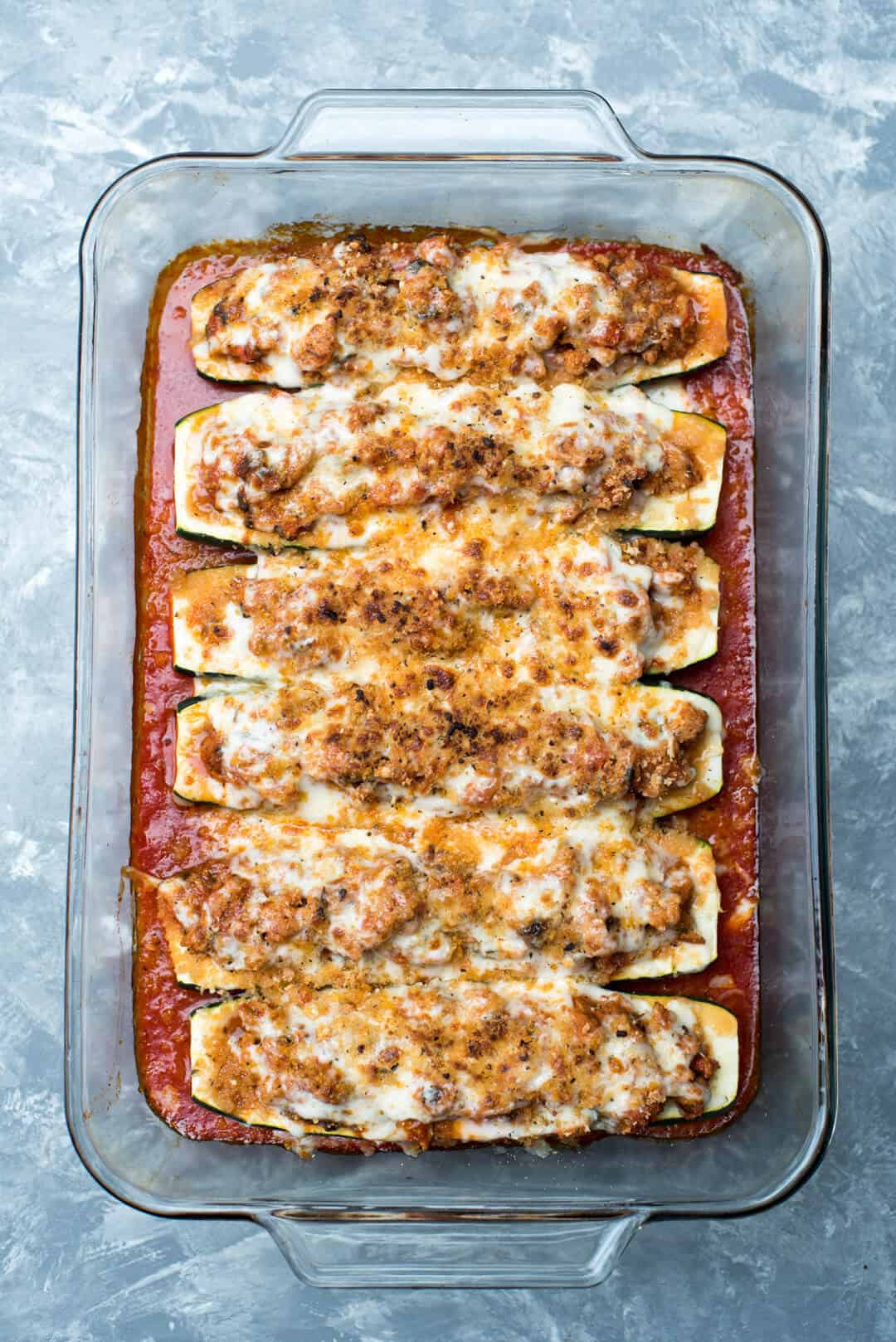 Zucchini Boats in a casserole dish.