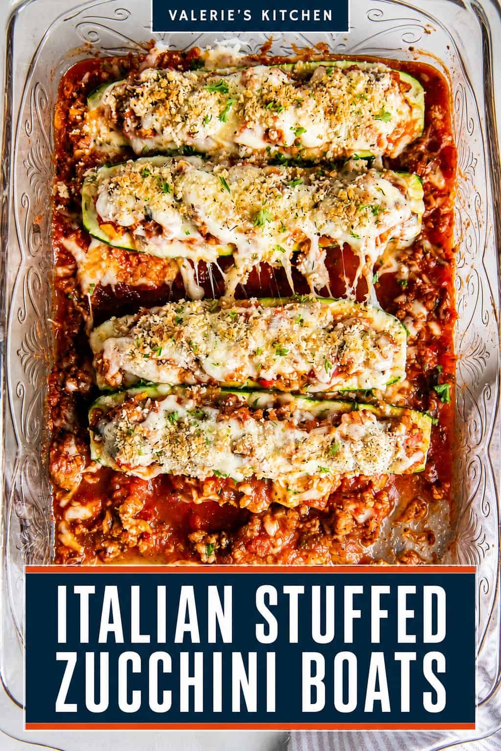 A spatula resting under an Italian Stuffed Zucchini Boat in a baking dish with bold title text overlay.