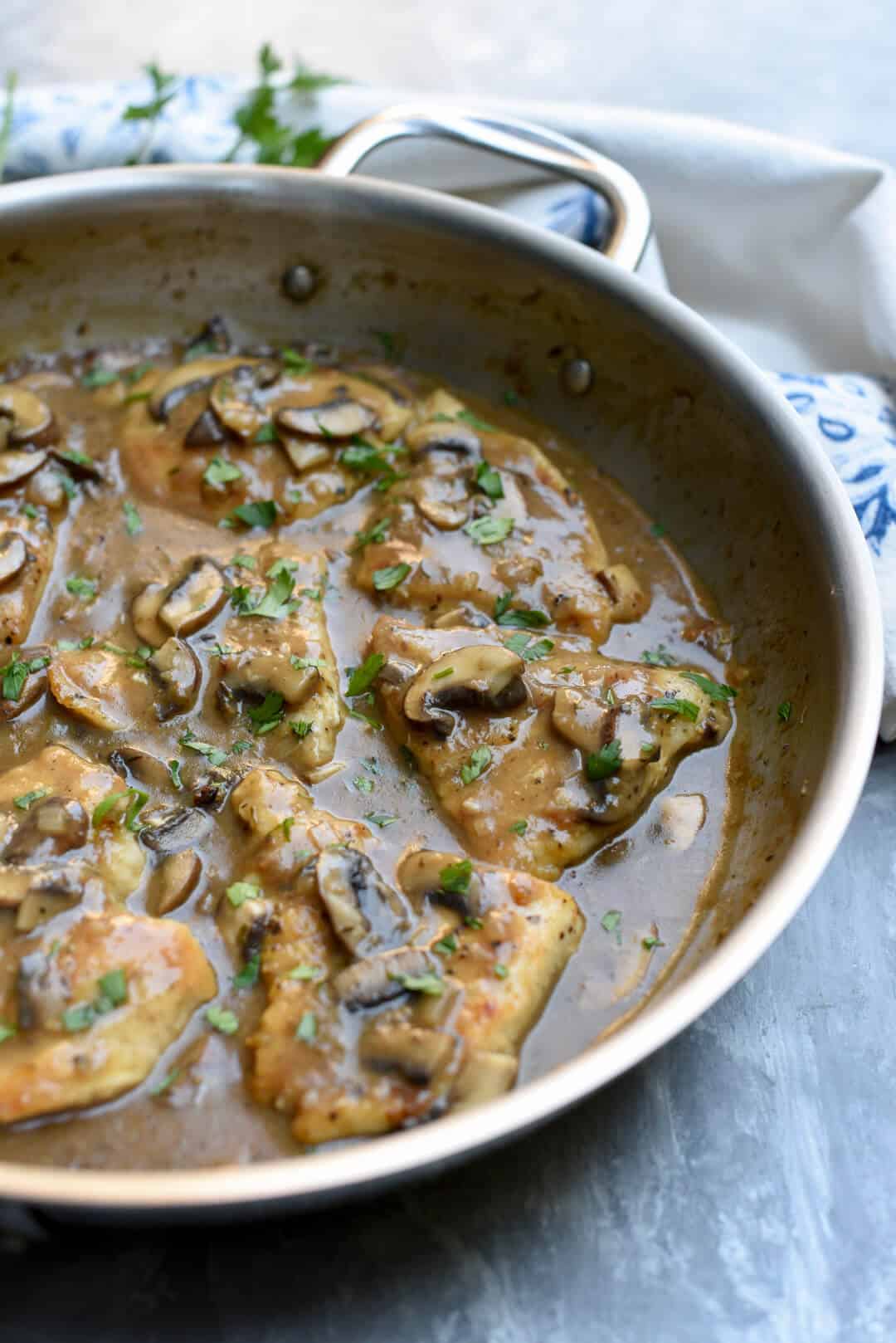 A closeup image of the Chicken Marsala in a skillet.