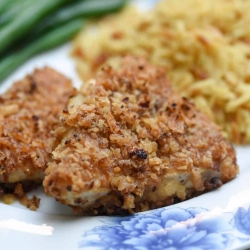 A close up browned breaded chicken on a plate.