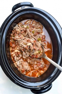 Shredded pork with beans in a slow cooker.