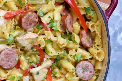 A skillet filled with Cheesy Cajun Pasta shot from over the top.