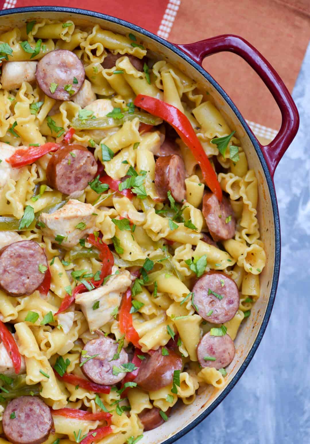 A skillet filled with Cheesy Cajun Pasta shot from over the top.