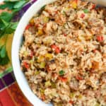 A bowl filled with a colorful rice mixture.