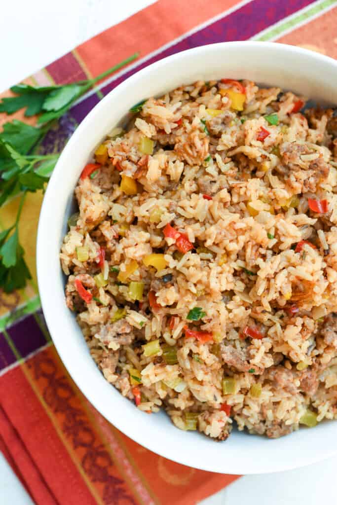 A bowl filled with a colorful rice mixture.