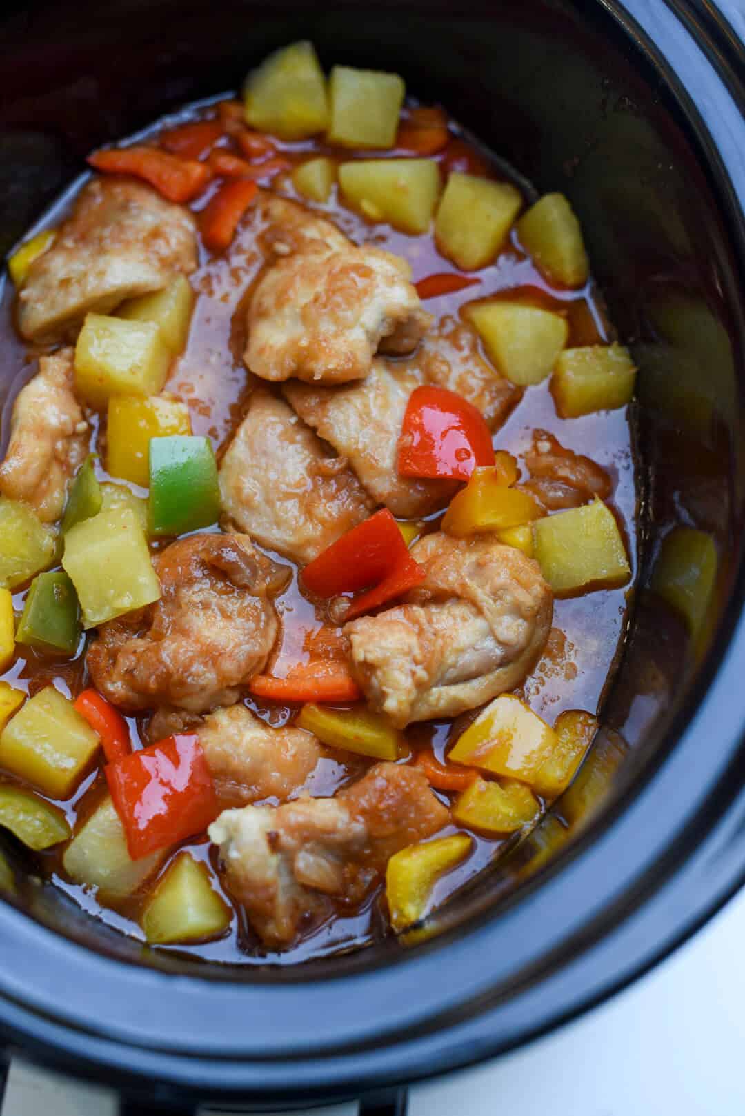 A close up of Slow Cooker Sweet and Sour Chicken in the slow cooker.